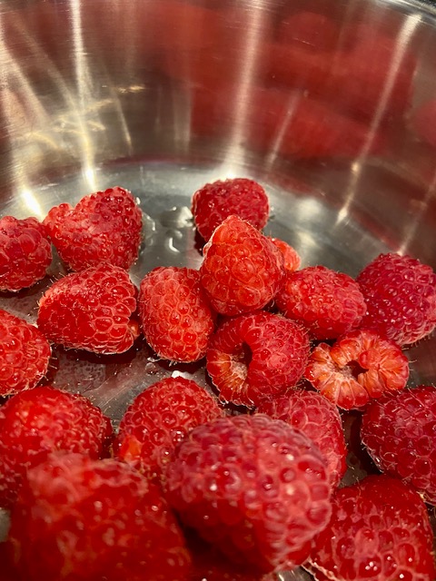 Fresh raspberries in a pot