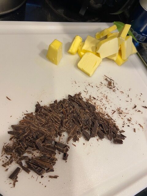 chopped up chocolate bar and cut up butter